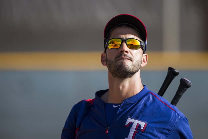 Texas Rangers outfielder Justin Ruggiano takes the field for a spring workout at the team's...