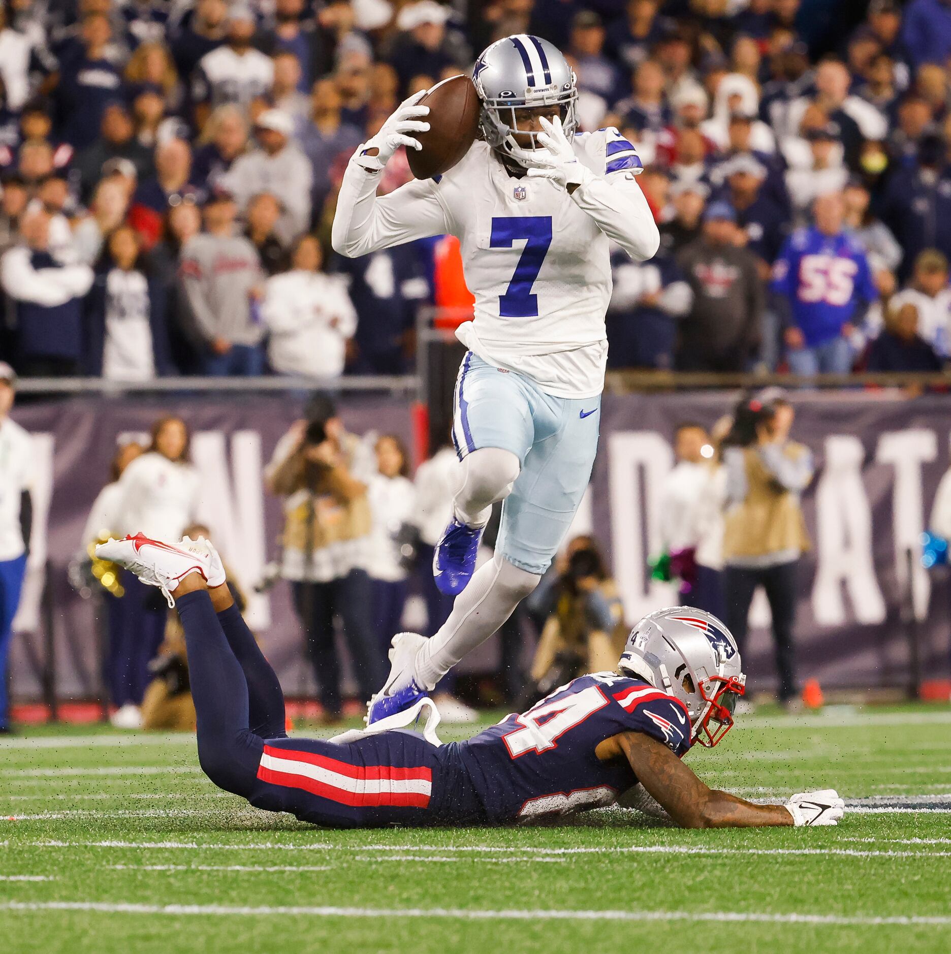 Dallas Cowboys cornerback Trevon Diggs (7) jumps over New England Patriots wide receiver...