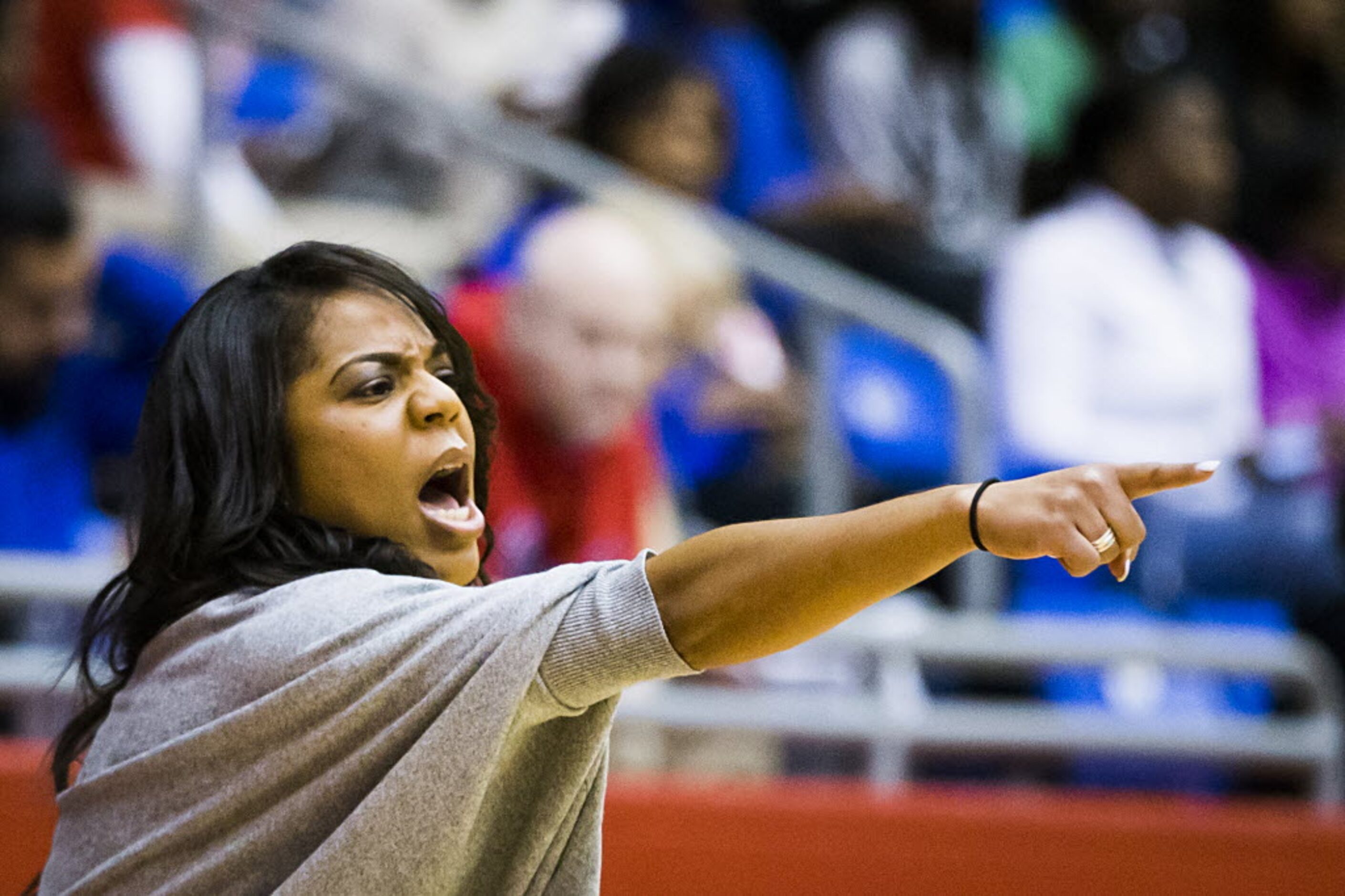 Cedar Hill head coach Nicole Collins directs her team during the first half of a girls high...