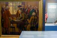 “Signing of The Declaration of Independence” by John Scott Williams from circa 1930 sits on...