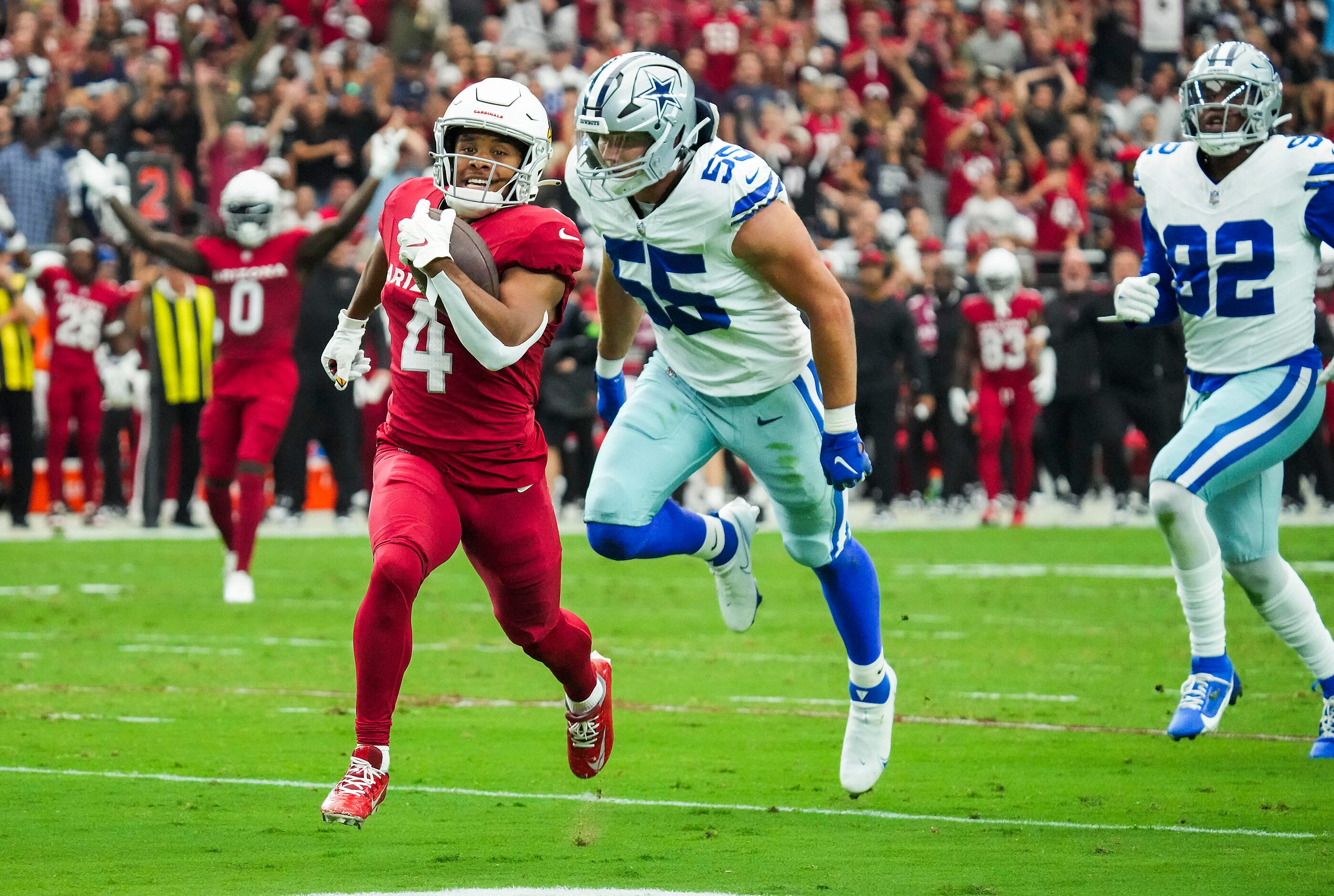 Arizona Cardinals wide receiver Rondale Moore (4) outruns Dallas Cowboys linebacker Leighton...