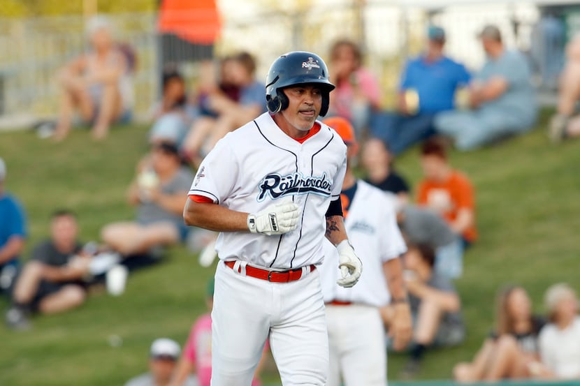 Cleburne Roughriders designated hitter Rafael Palmeiro returns to the dugout after being...