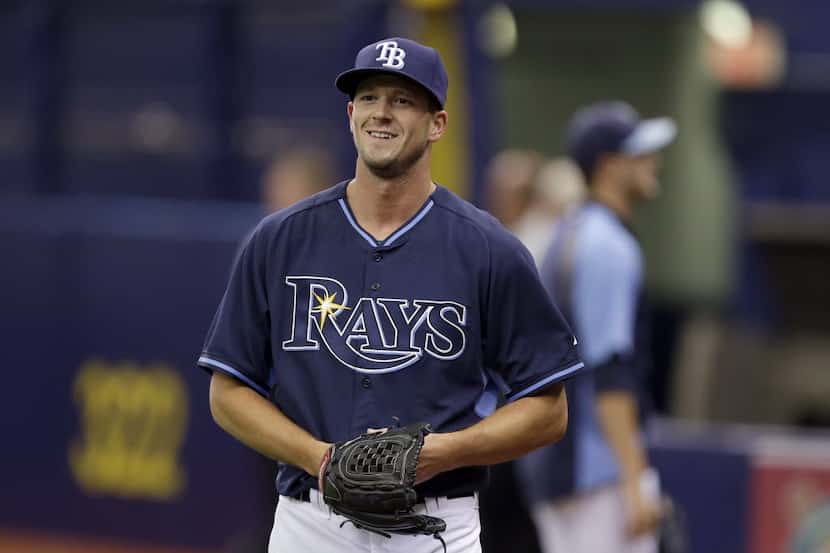 FILE - Tampa Bay Rays starting pitcher Drew Smyly smiles after throwing a bullpen session...
