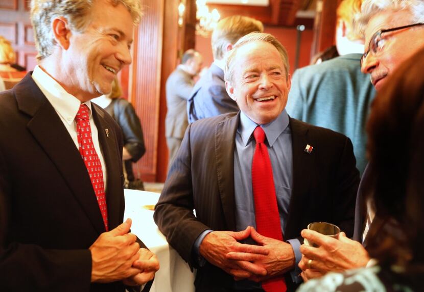 U.S. Sen. Rand Paul (left) and Texas Senate candidate Phillip Huffines mingle with the crowd...