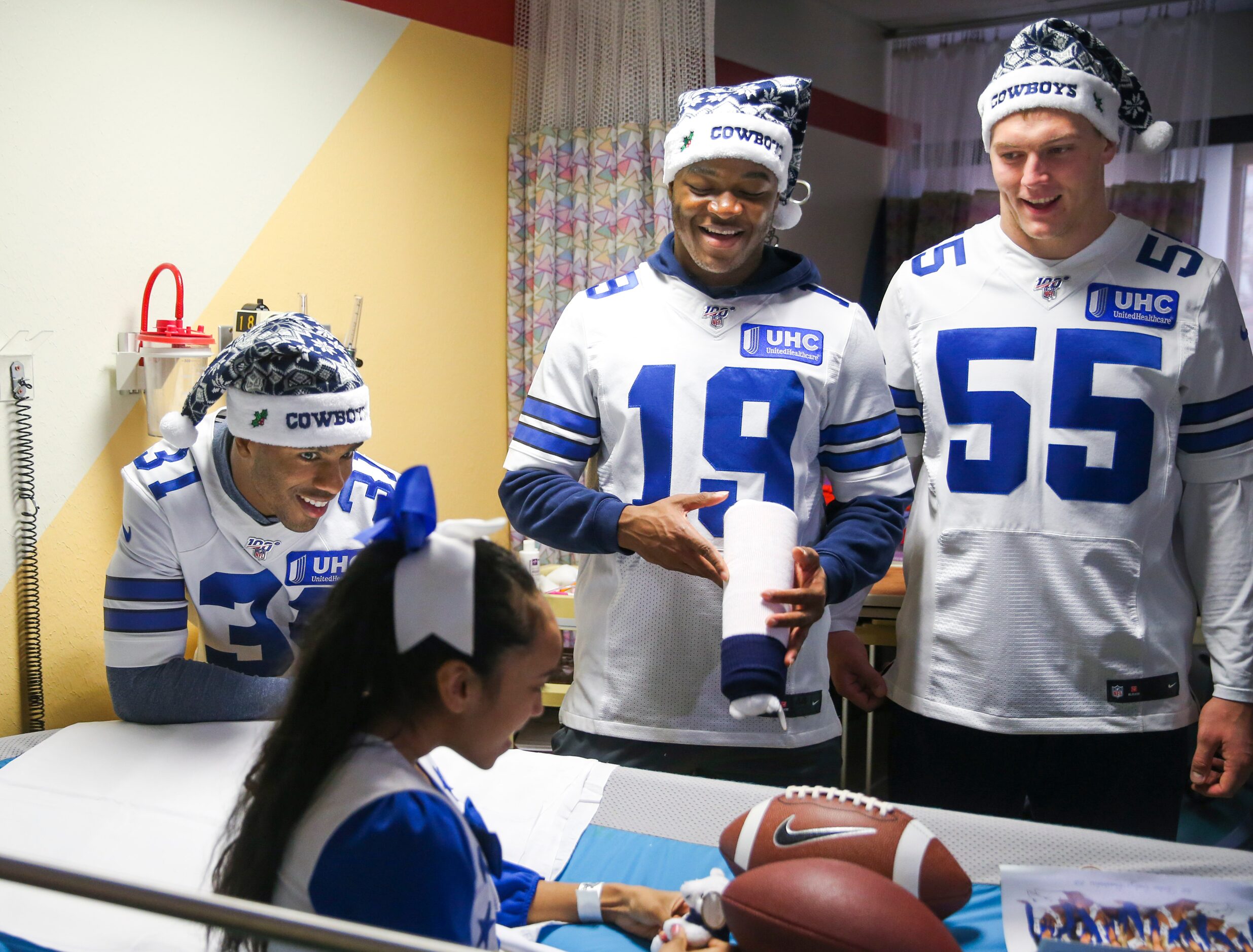 Dallas Cowboys cornerback Byron Jones (31) chats with Deshony âShonyâ Caraway, 12, along...