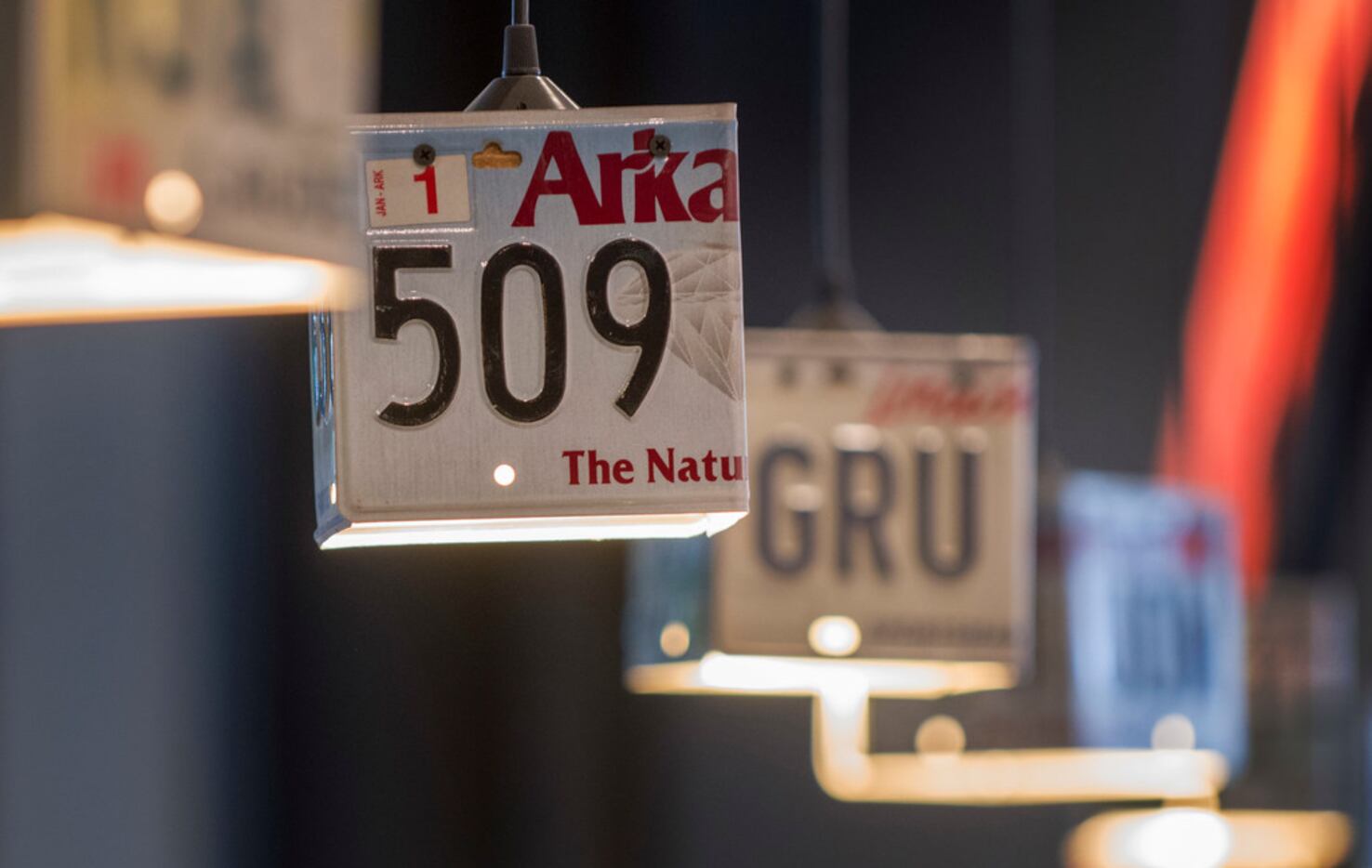 Light shades made of old license plates hang over the bar at Highway 61 South, a blues and...