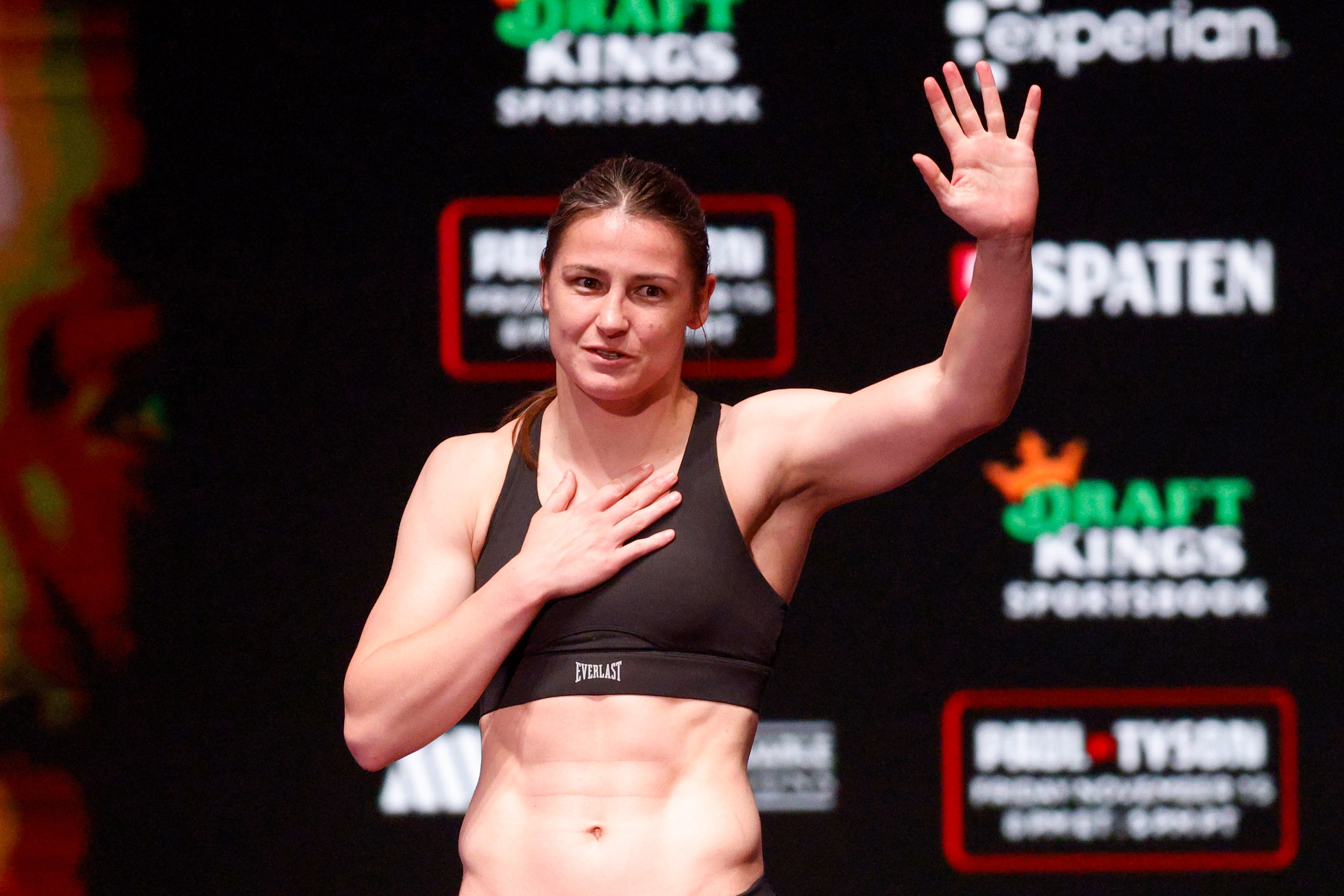 Katie Taylor waves to the crowd as she weighs-in ahead of her boxing match against Amanda...