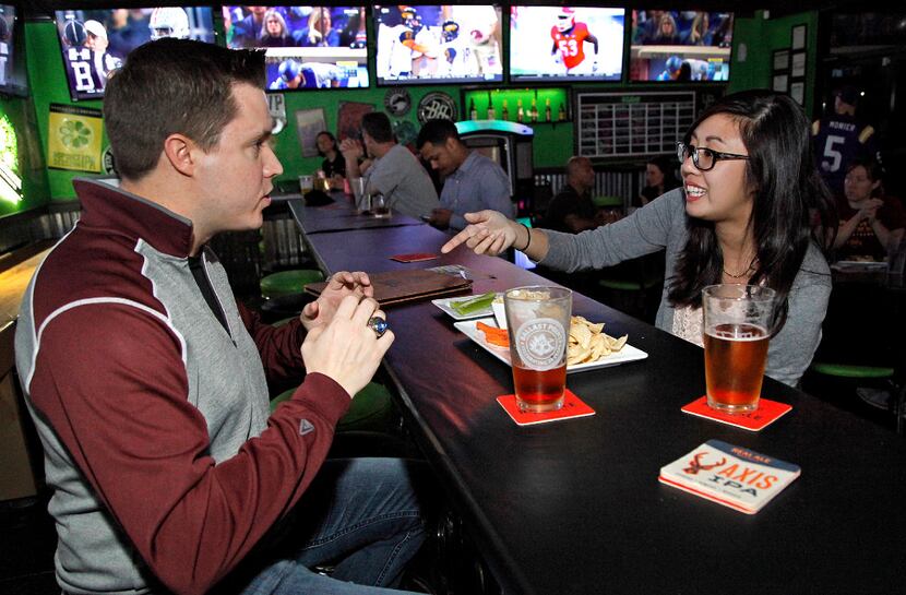 Flower Mound residents Matt Czajak (left) and Melissa Tran have custom brewed beer with...