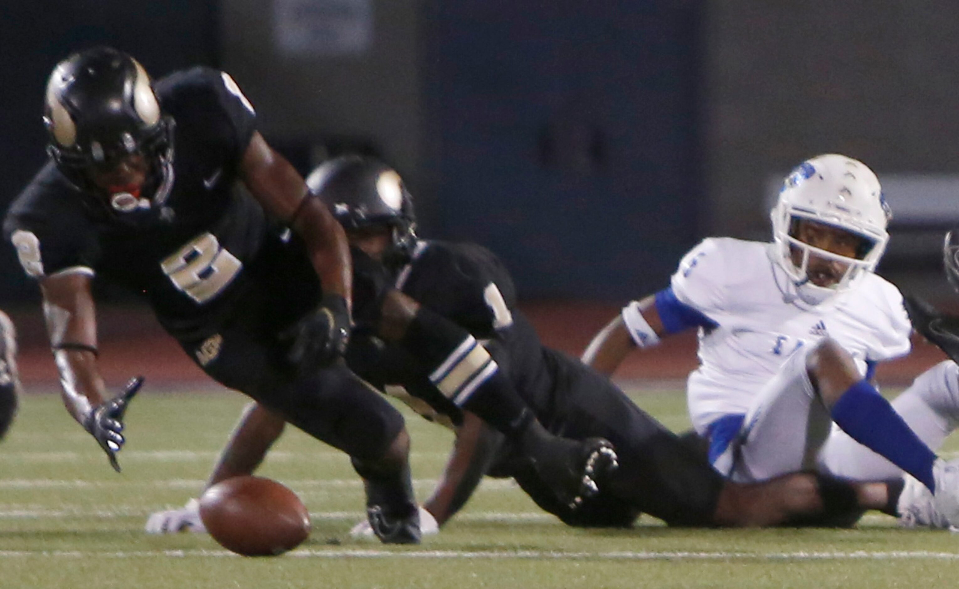 Dallas Pinkston receiver Keidrum Chambers-Bell (2) leaps to recover a fumbled kickoff as...