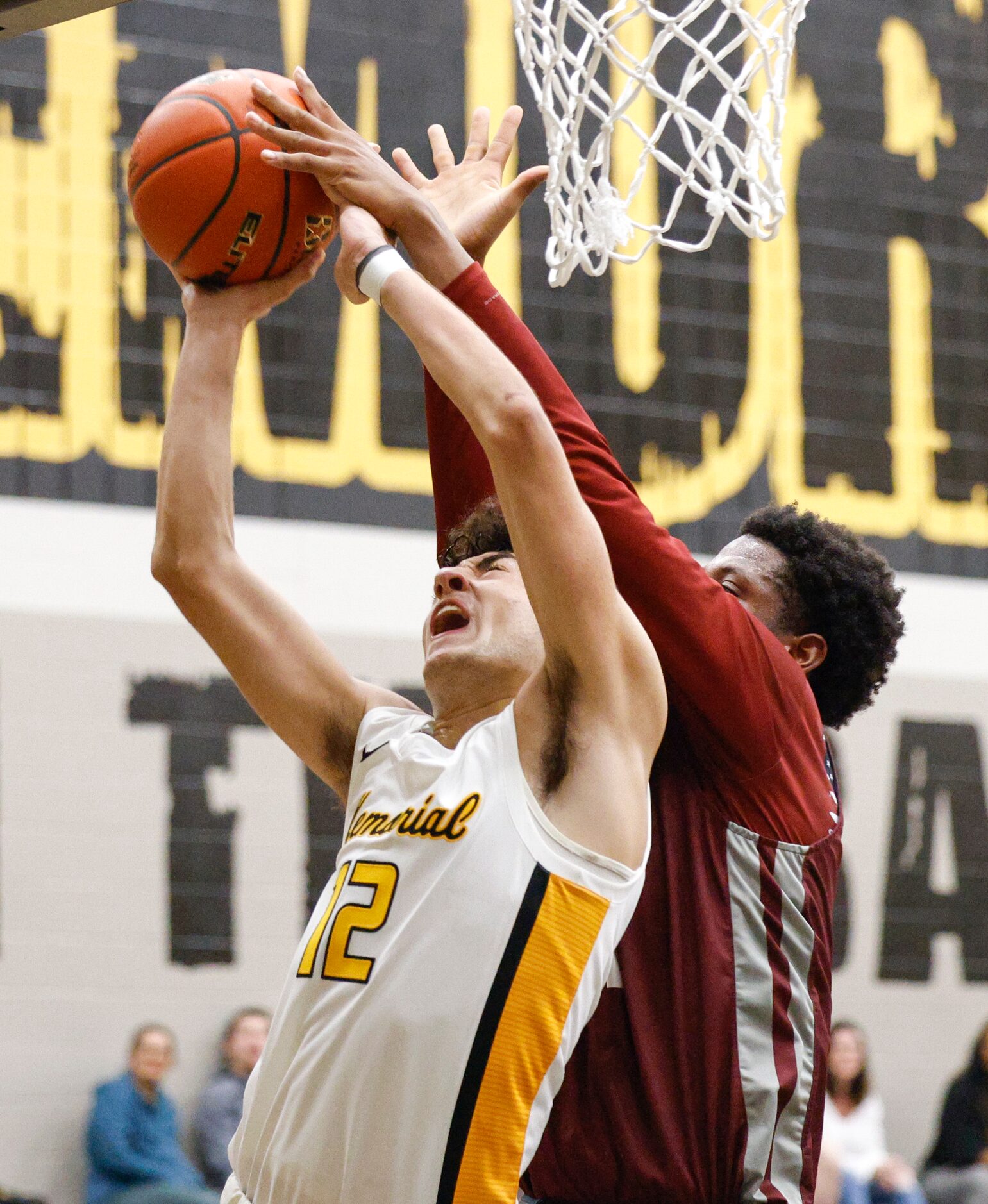 Plano forward Justin McBride (21) blocks a shot attempt from Frisco Memorial guard Jaxson...