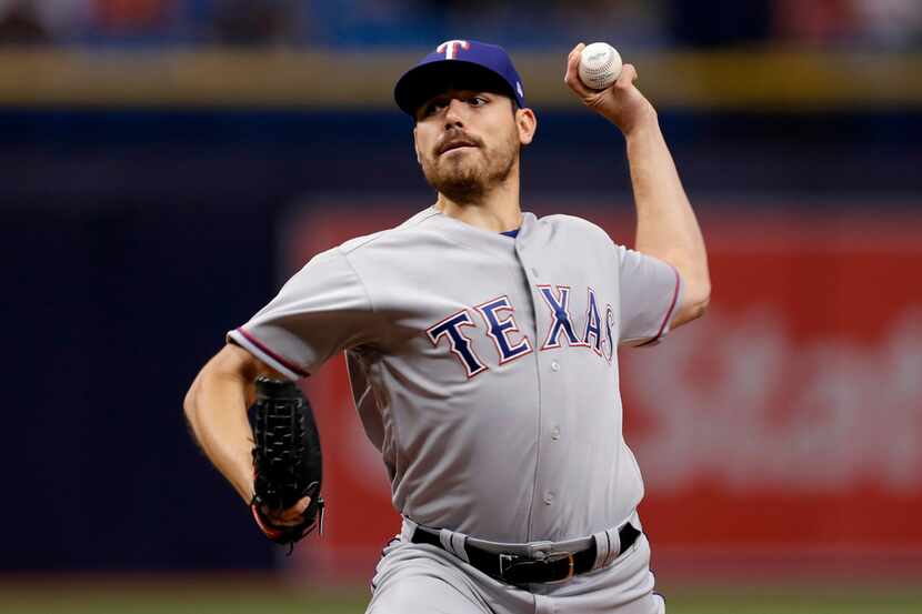 Texas Rangers starting pitcher Matt Moore during the first inning of a baseball game against...