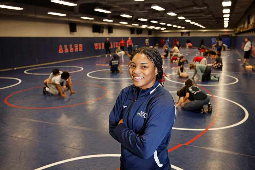 Allen High School senior Jasmine Robinson poses for a photo during her wrestling practice at...