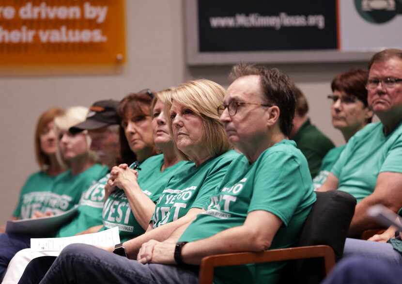 McKinney residents listen to public comments regarding a plan to expand U.S. Highway 380...