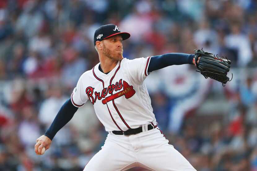 Atlanta Braves starting pitcher Mike Foltynewicz throws in the first inning of Game 5 of...