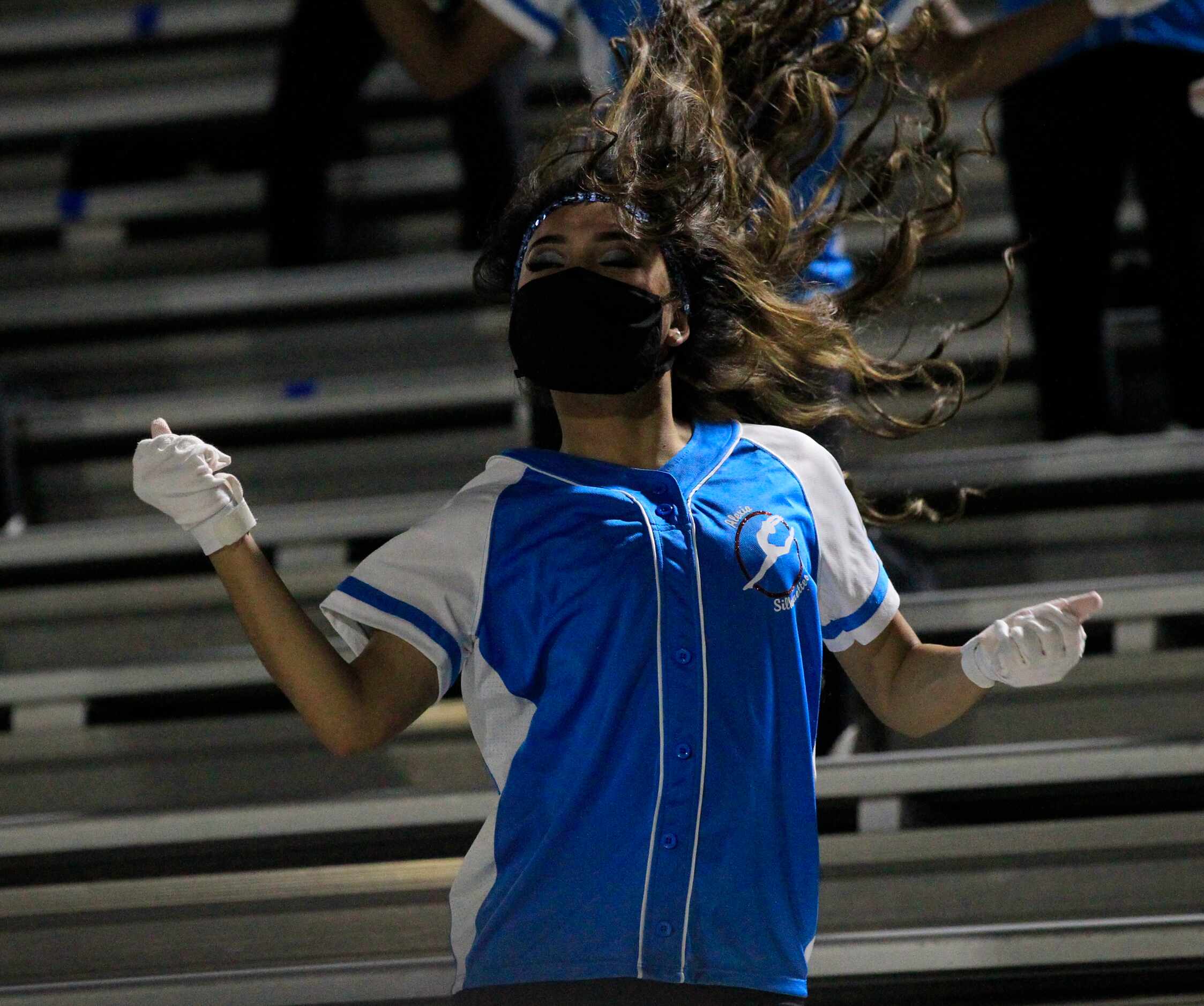 A Skyline dancer's hair flies in the air during a routine in the stands during the first...