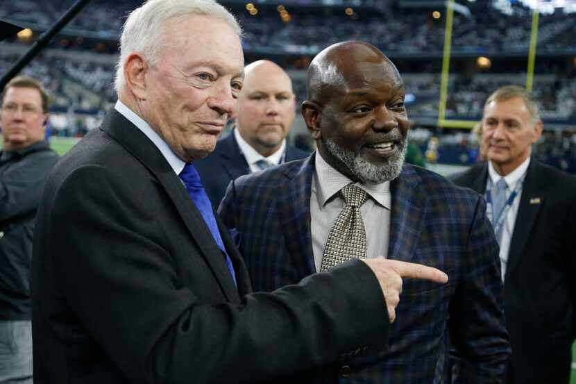 Dallas Cowboys owner Jerry Jones, left, and former running back Emmitt Smith talk before an...