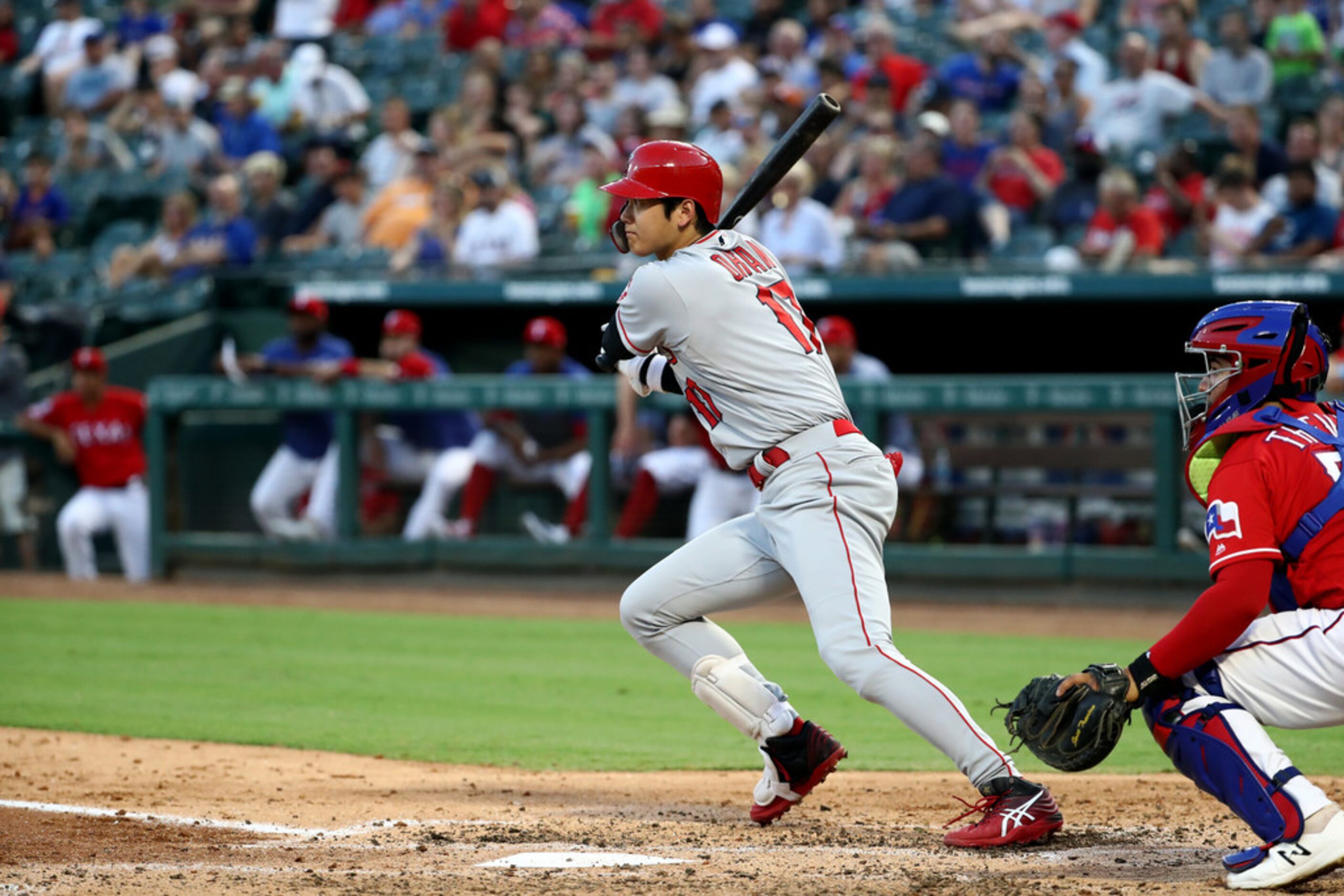 ARLINGTON, TEXAS - AUGUST 19:  Shohei Ohtani #17 of the Los Angeles Angels hits a triple...