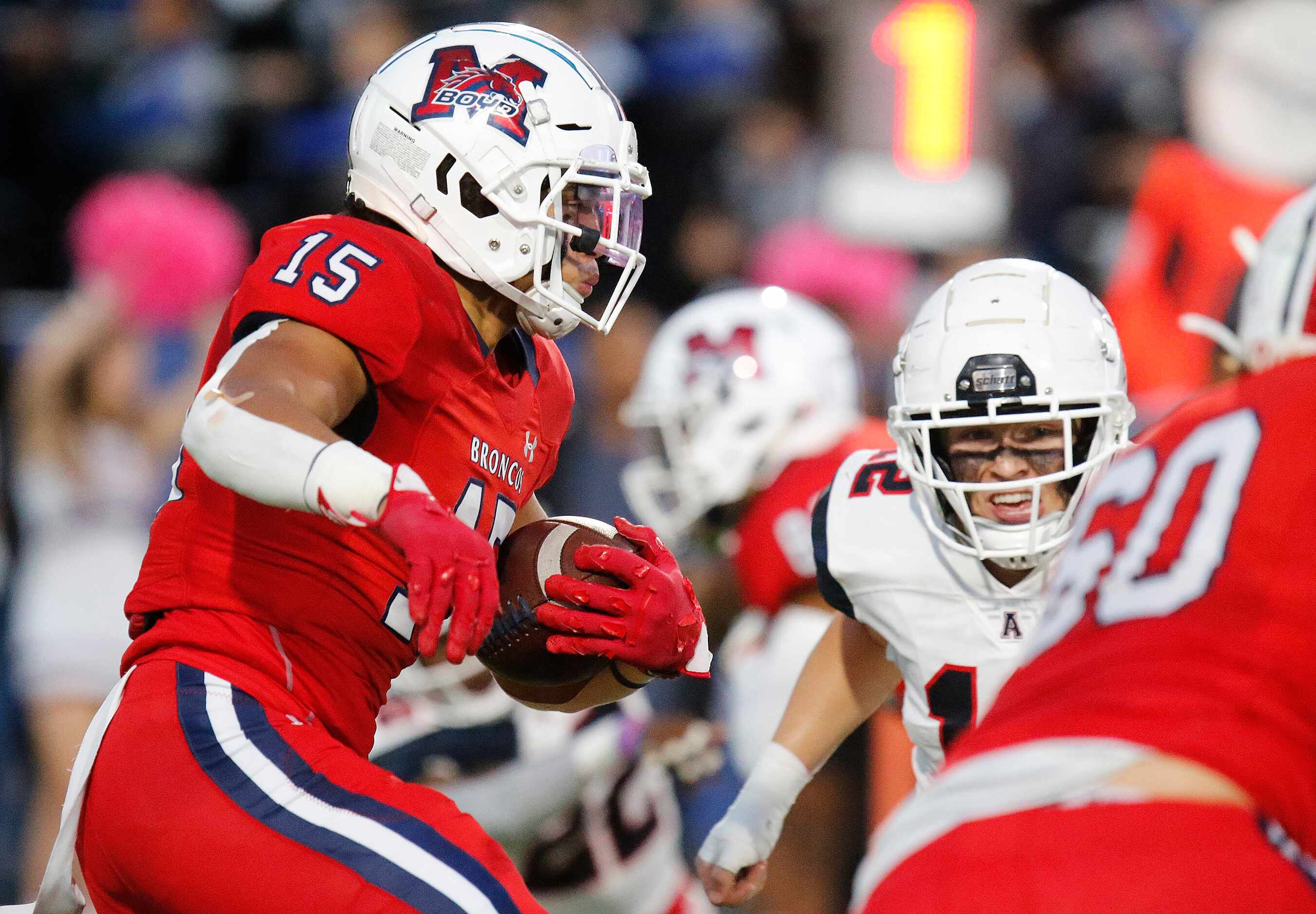 McKinney Boyd High School running back Carter Whitefield (15) carries the football during...