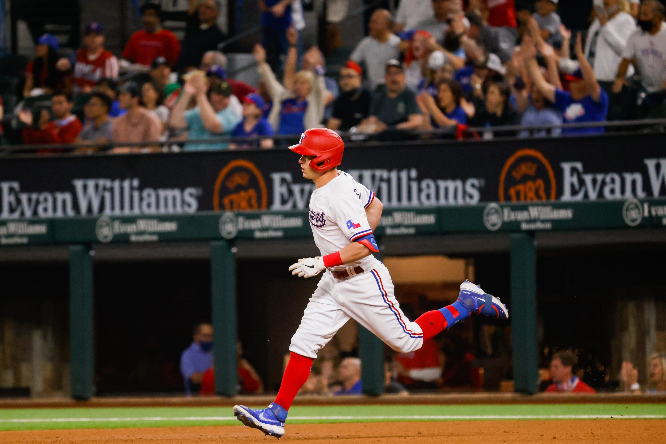 Texas Rangers second baseman Nick Solak (15) runs to second base after hitting a homer on a...