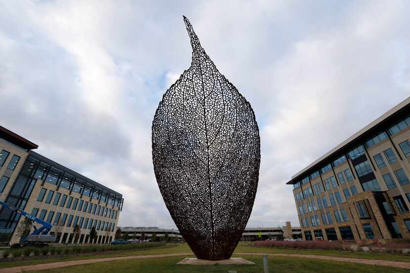 An art installation of a leaf on display at Cypress Waters development in Irving on Tuesday,...