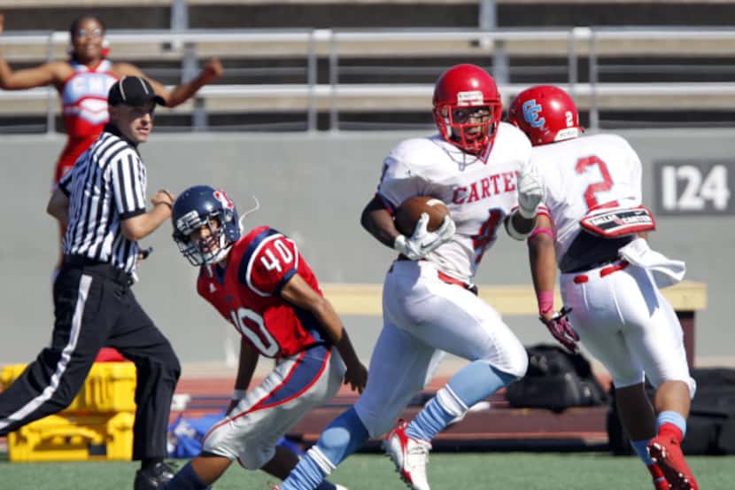 Carter's Jamal Carter (4) eludes Kimball's Corey Smith during a kickoff return in their 2011...