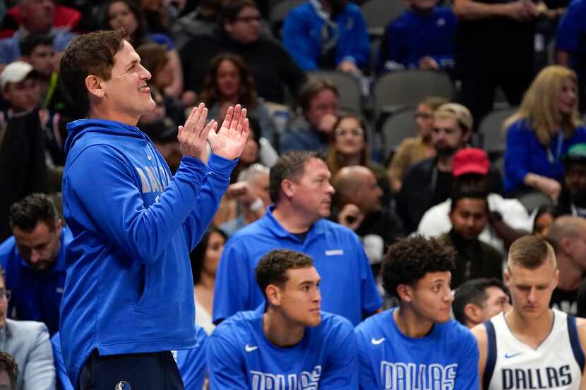 Dallas Mavericks owner Mark Cuban cheers his team during the second half of an NBA...