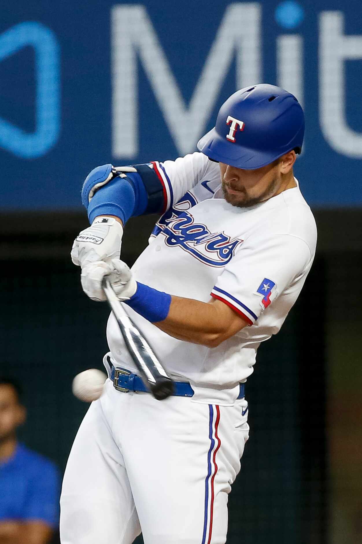 Texas Rangers first baseman Nathaniel Lowe (30) swings for the ball during the first inning...