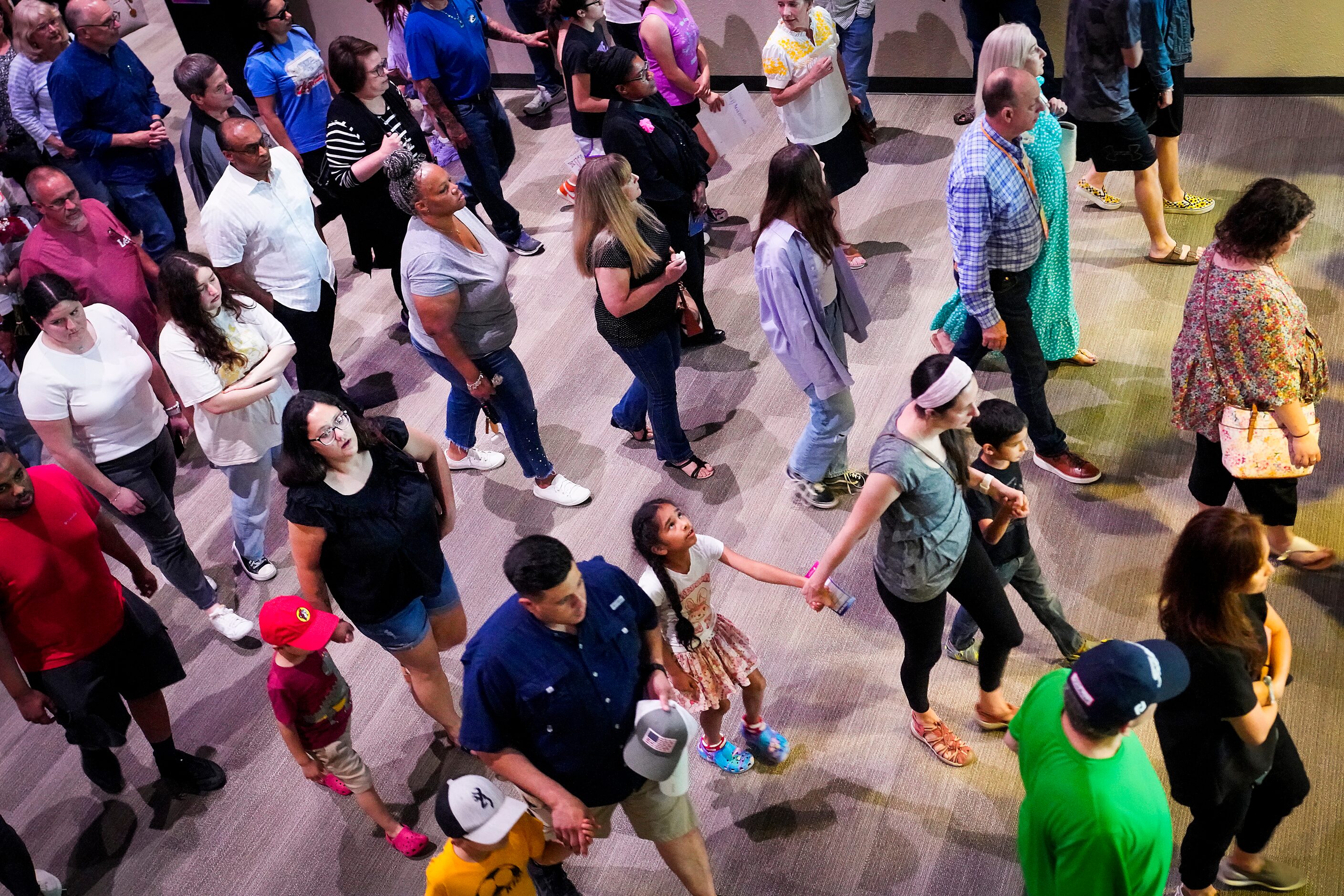 People file out after a vigil at Cottonwood Creek Church a day after a mass shooting at...