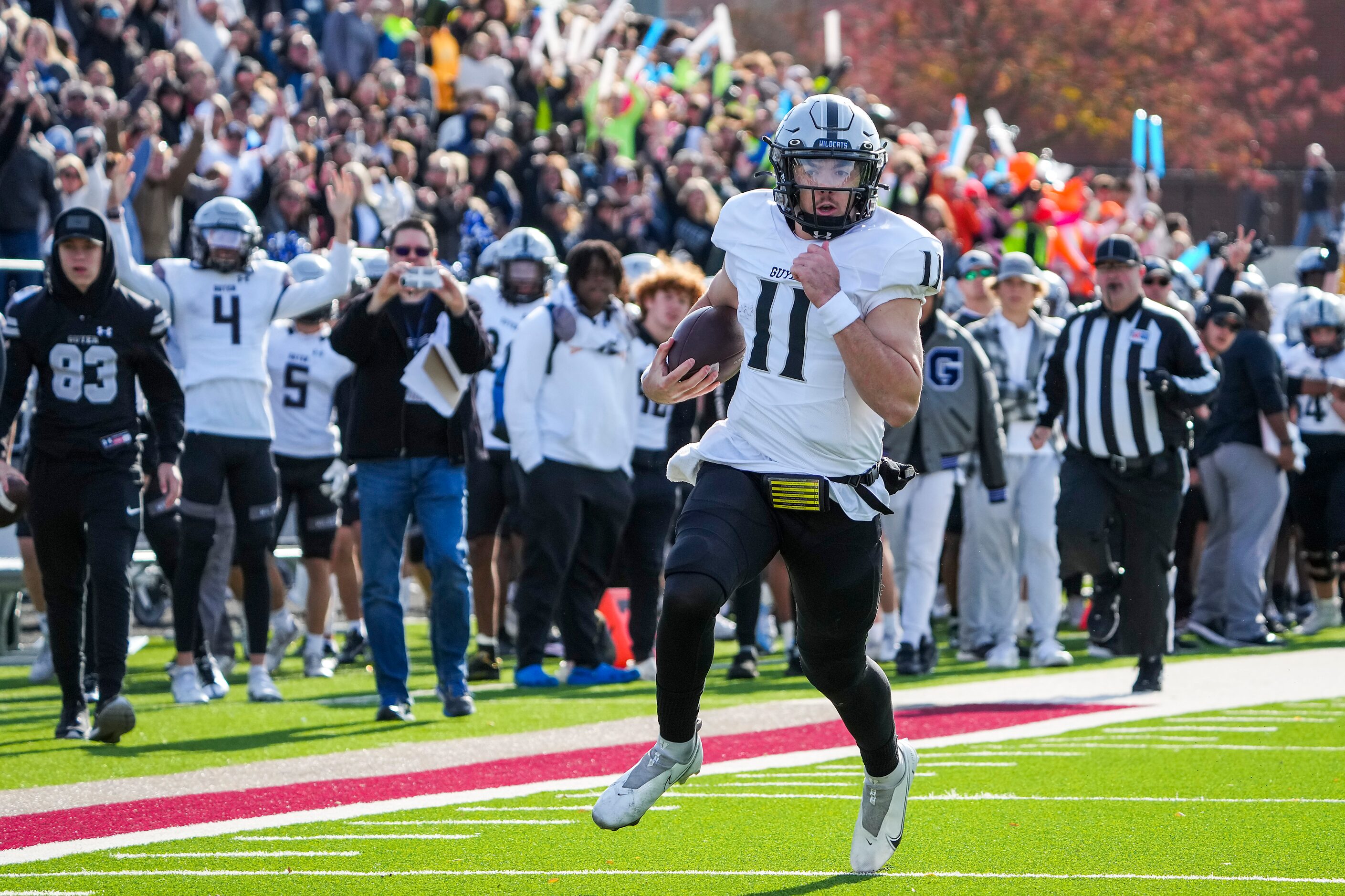 Denton Guyer quarterback Jackson Arnold (11) races down the sidelines on a 49-yard touchdown...