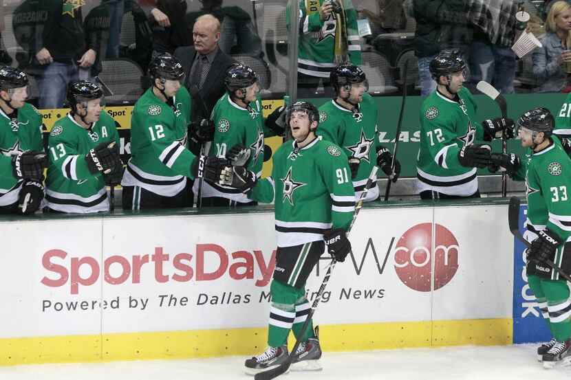 Dallas Stars center Tyler Seguin (91) watches his goal on the replay as he gets high-fives...