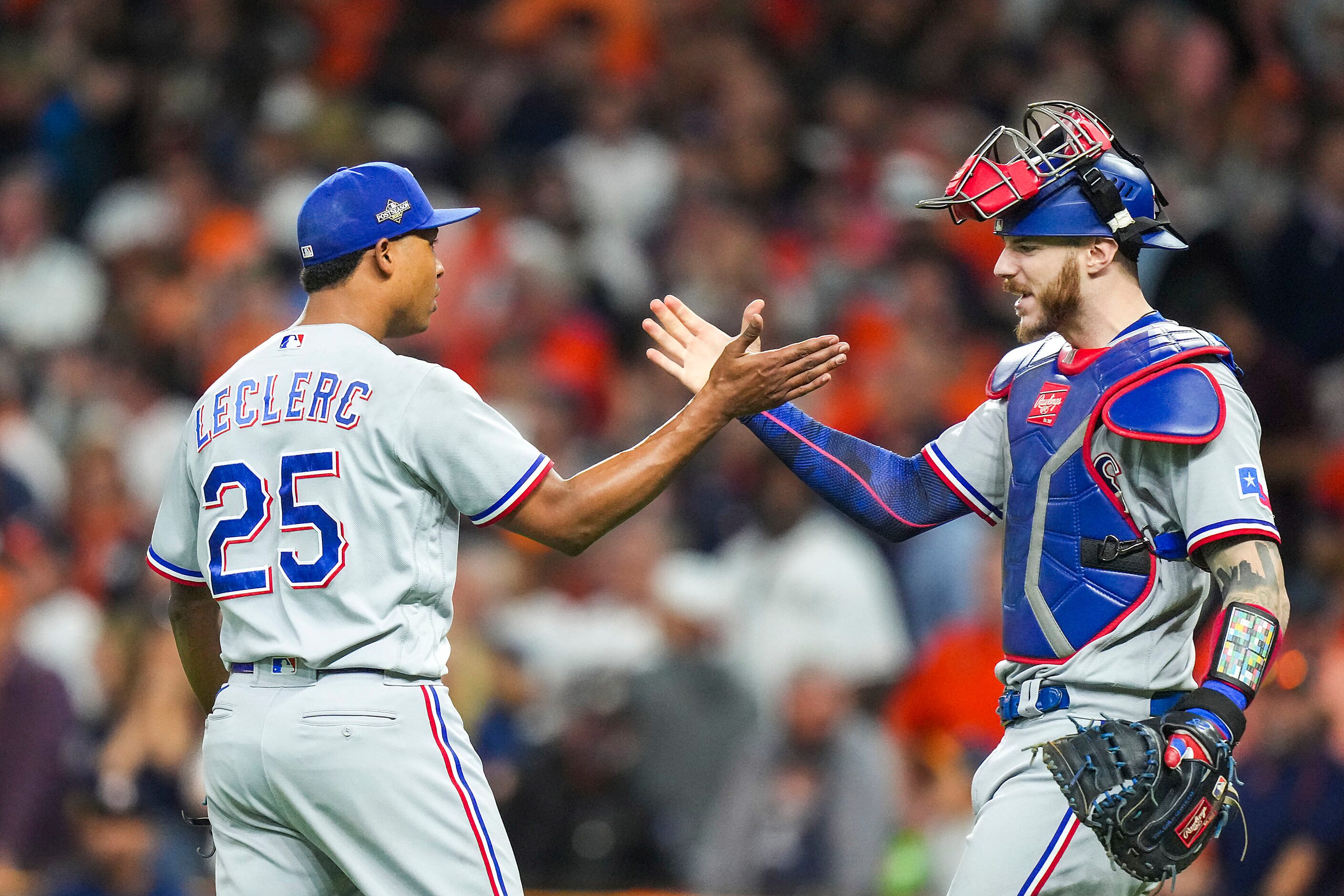 Texas Rangers relief pitcher Jose Leclerc celebrates with catcher Jonah Heim after the final...