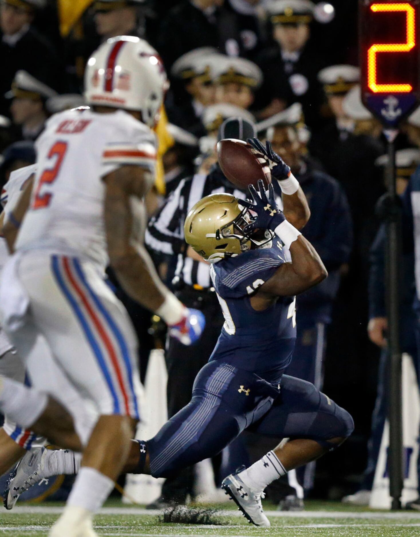 Navy Midshipmen fullback Nelson Smith (43) tries to bring down a bobbled ball against the...