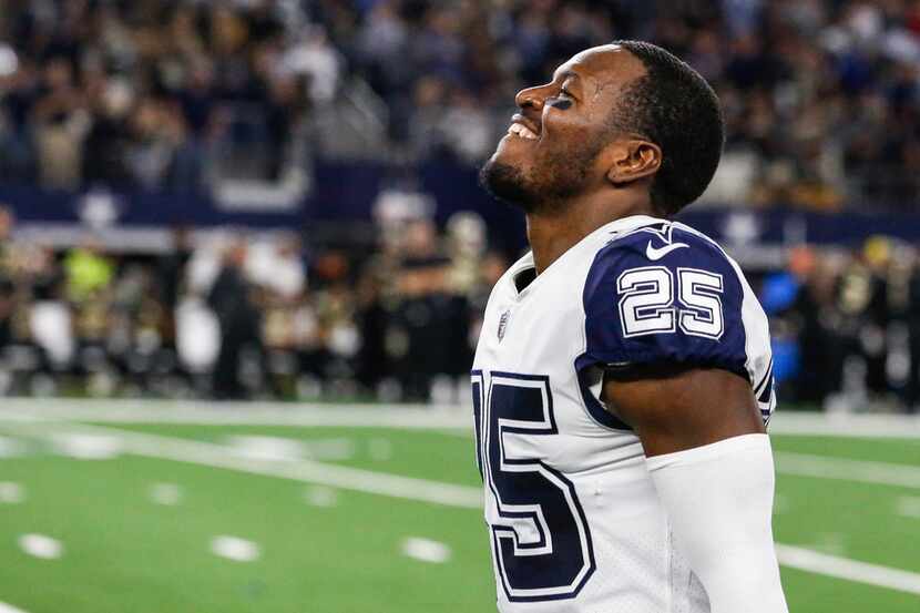 Dallas Cowboys free safety Xavier Woods (25) celebrates in the final moments of the Cowboys...