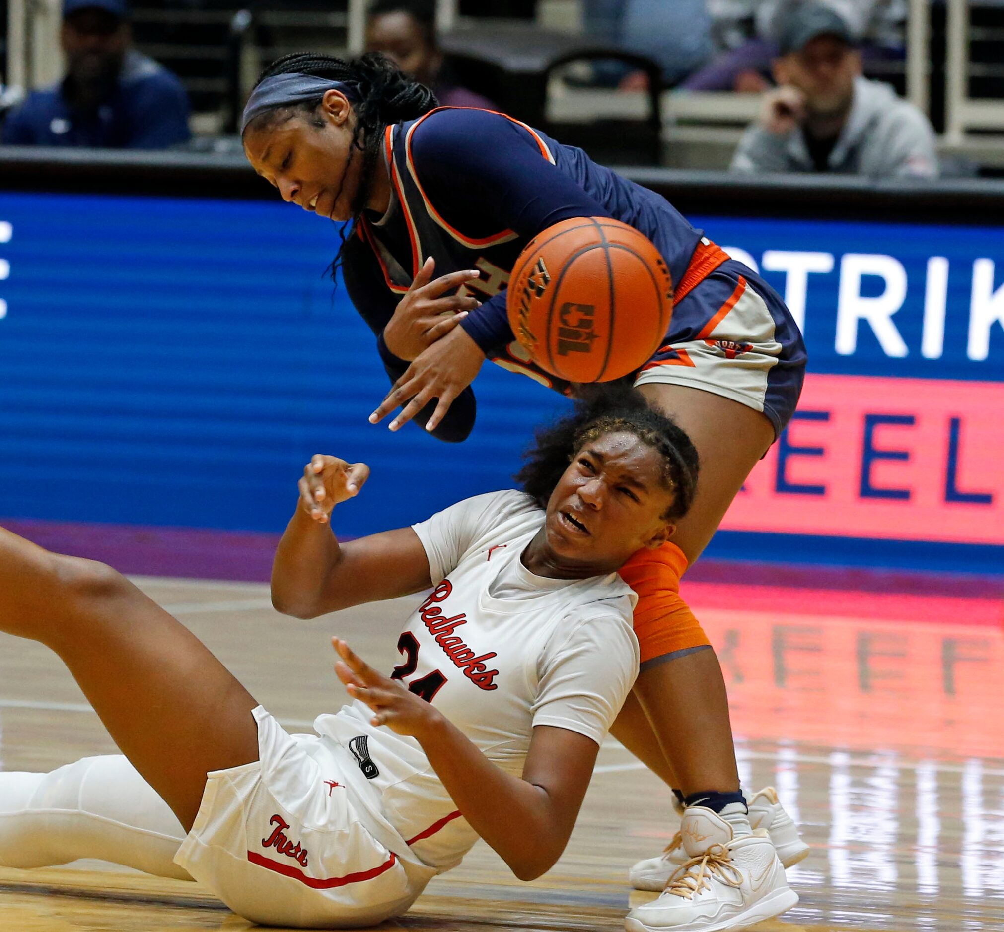 Frisco Liberty High’s G Jacy Abii (24) tumbles, as she and McKinney North high's G/F Ciara...