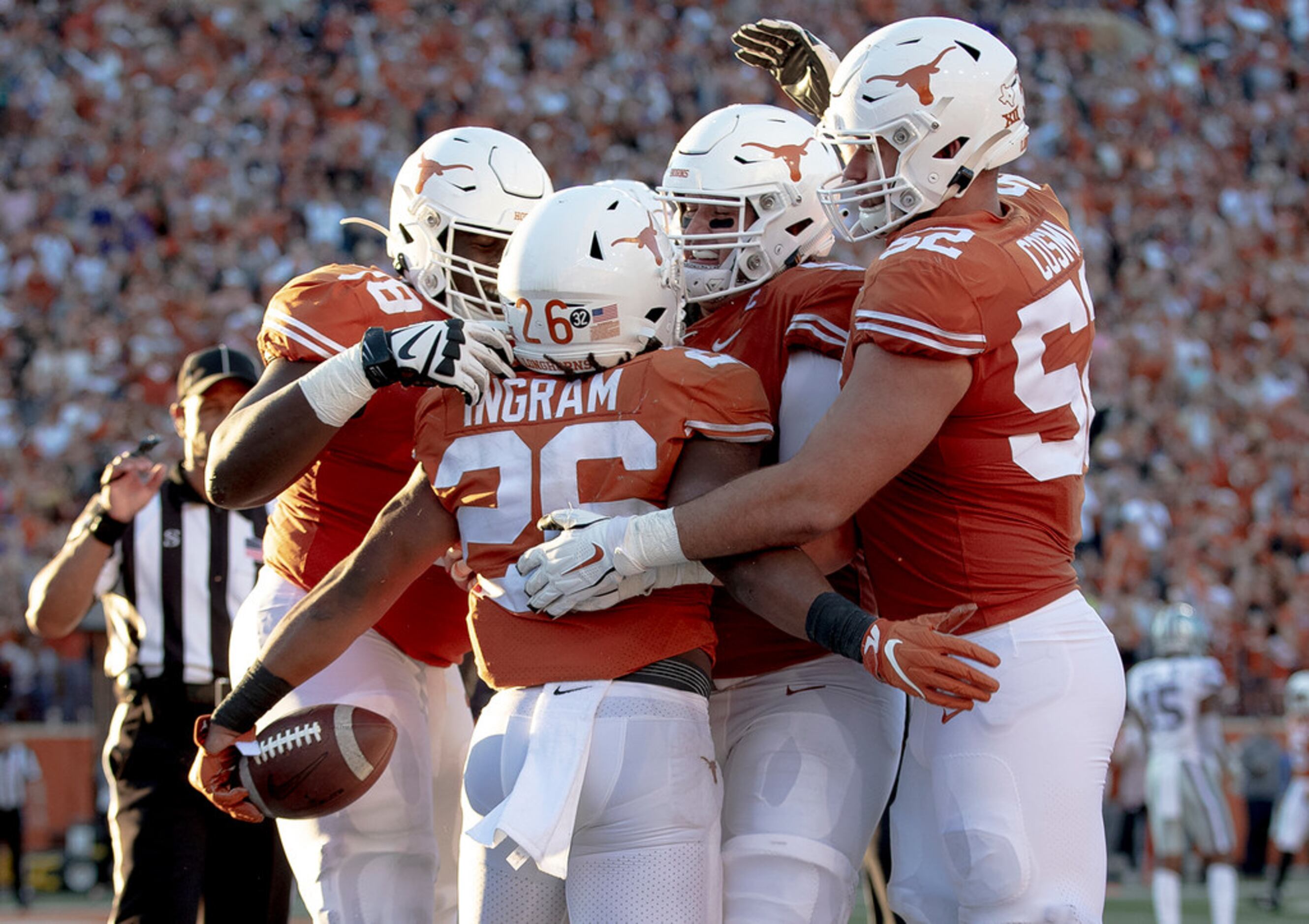 Texas running back Keaontay Ingram (26) celebrates a touchdown with teammates during an NCAA...