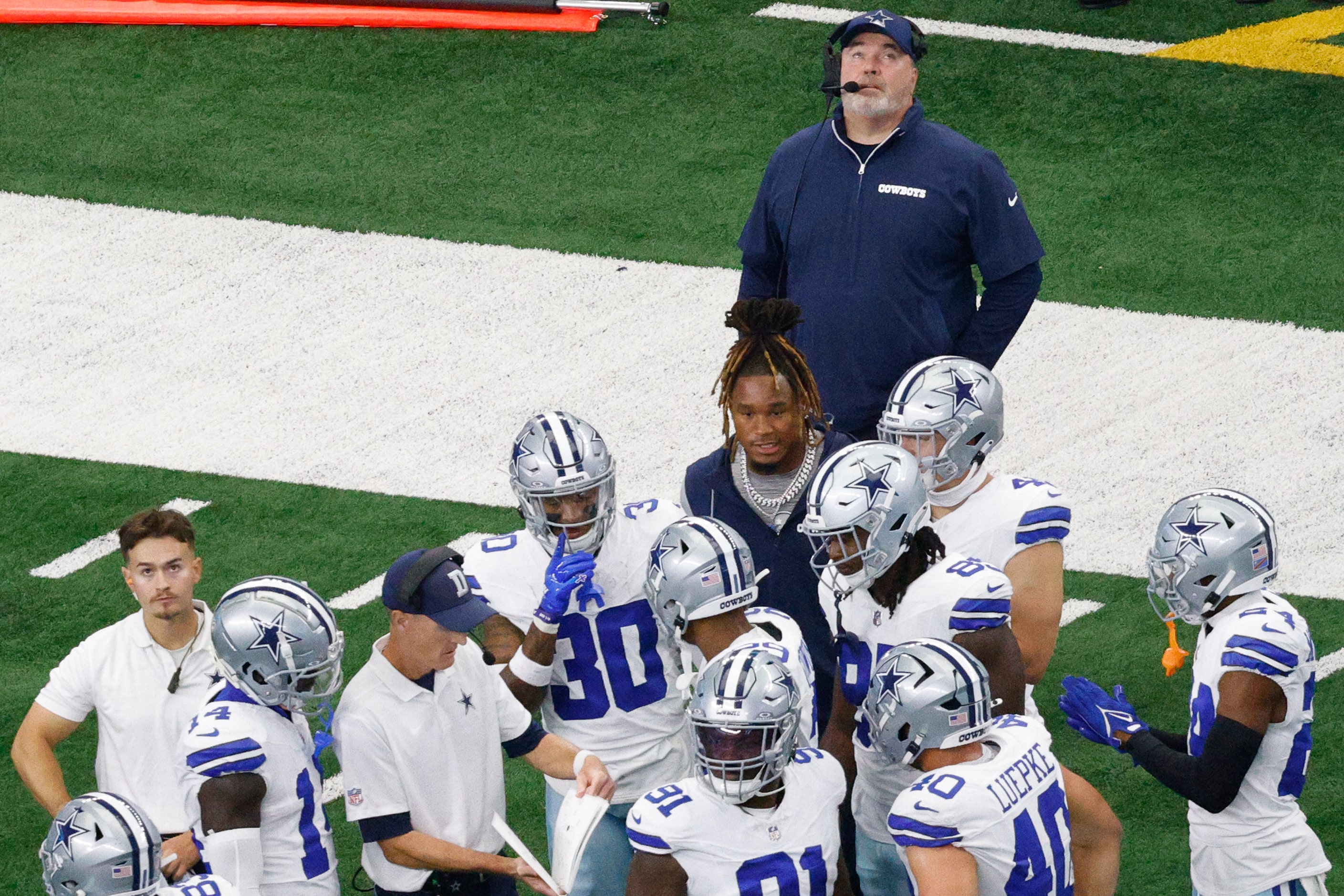 Dallas Cowboys head coach Mike McCarthy looks up during a timeout in the first half of an...