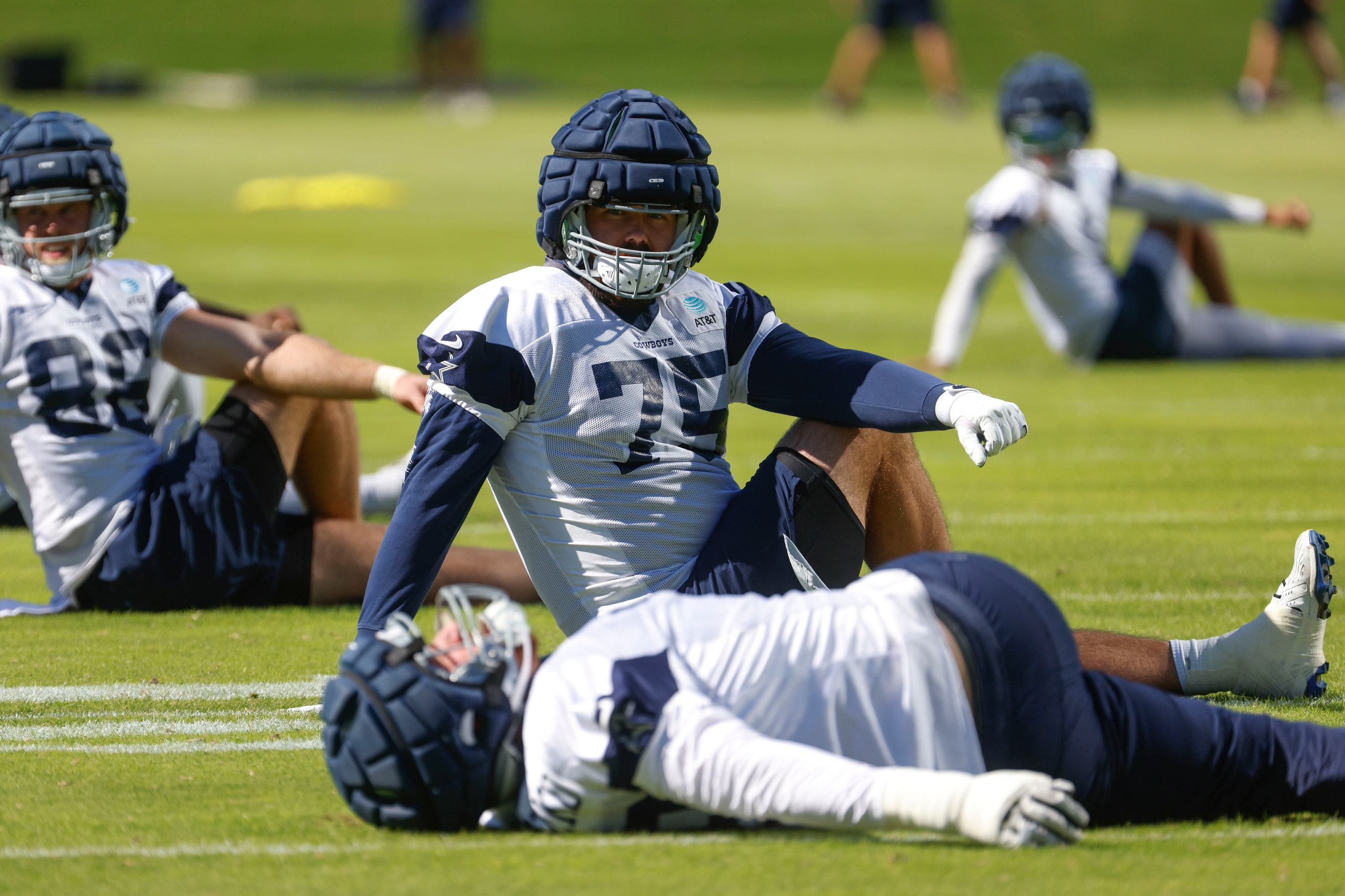 Dallas Cowboys offensive tackle Josh Ball (75) stretches during a team practice on...