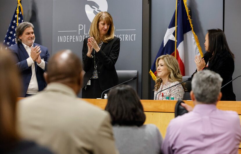 From left, president of Plano ISD David Stole, superintendent Sara Bonser, and board member...