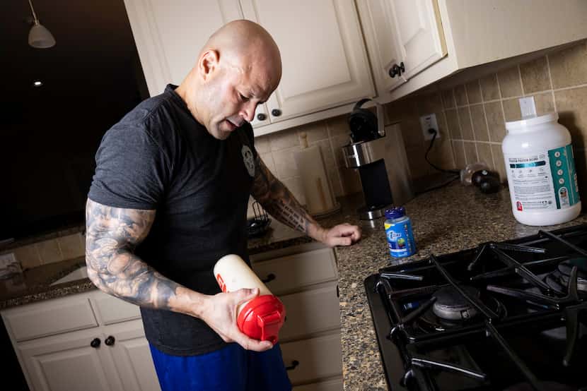 Dallas police Chief Eddie García prepares a protein shake after his daily morning workout at...