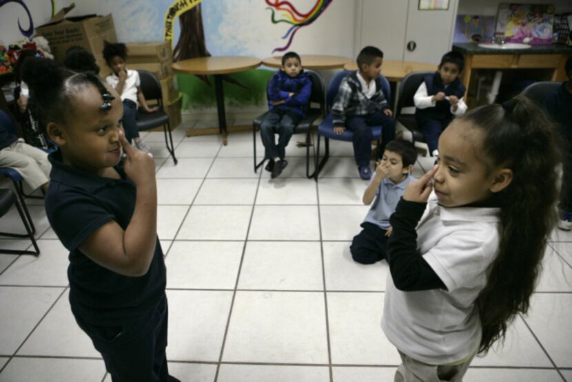 Tatianna Seaton, 6 (left), and Naomi Moore, 5, mirror each other in Creative Dramatics class.