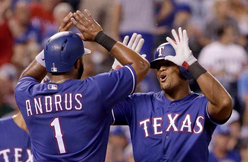 Texas Rangers' Adrian Beltre, right, celebrates with Elvis Andrus after hitting a three-run...