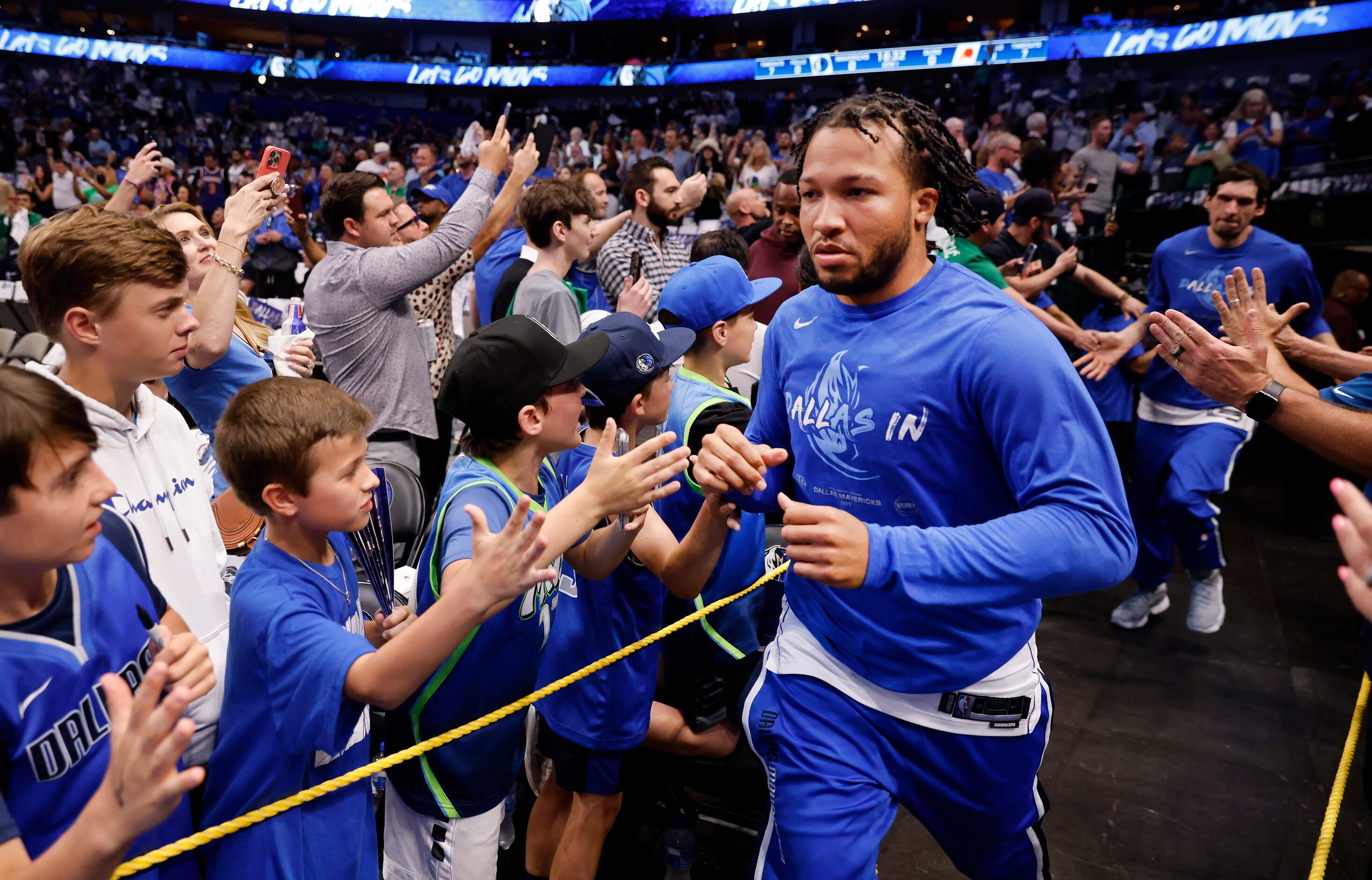 Dallas Mavericks guard Jalen Brunson (13) races onto the court to face the Phoenix Suns in...