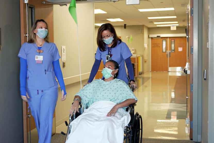 Nurses at Baylor Scott & White Health escort a patient in a wheelchair