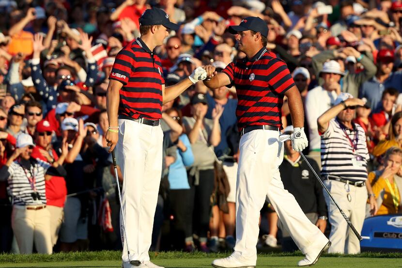 CHASKA, MN - OCTOBER 01: Jordan Spieth and Patrick Reed of the United States react on the...
