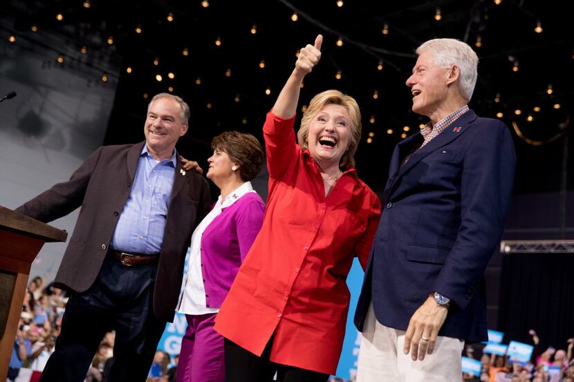 Democratic presidential candidate Hillary Clinton, second from right, accompanied by...