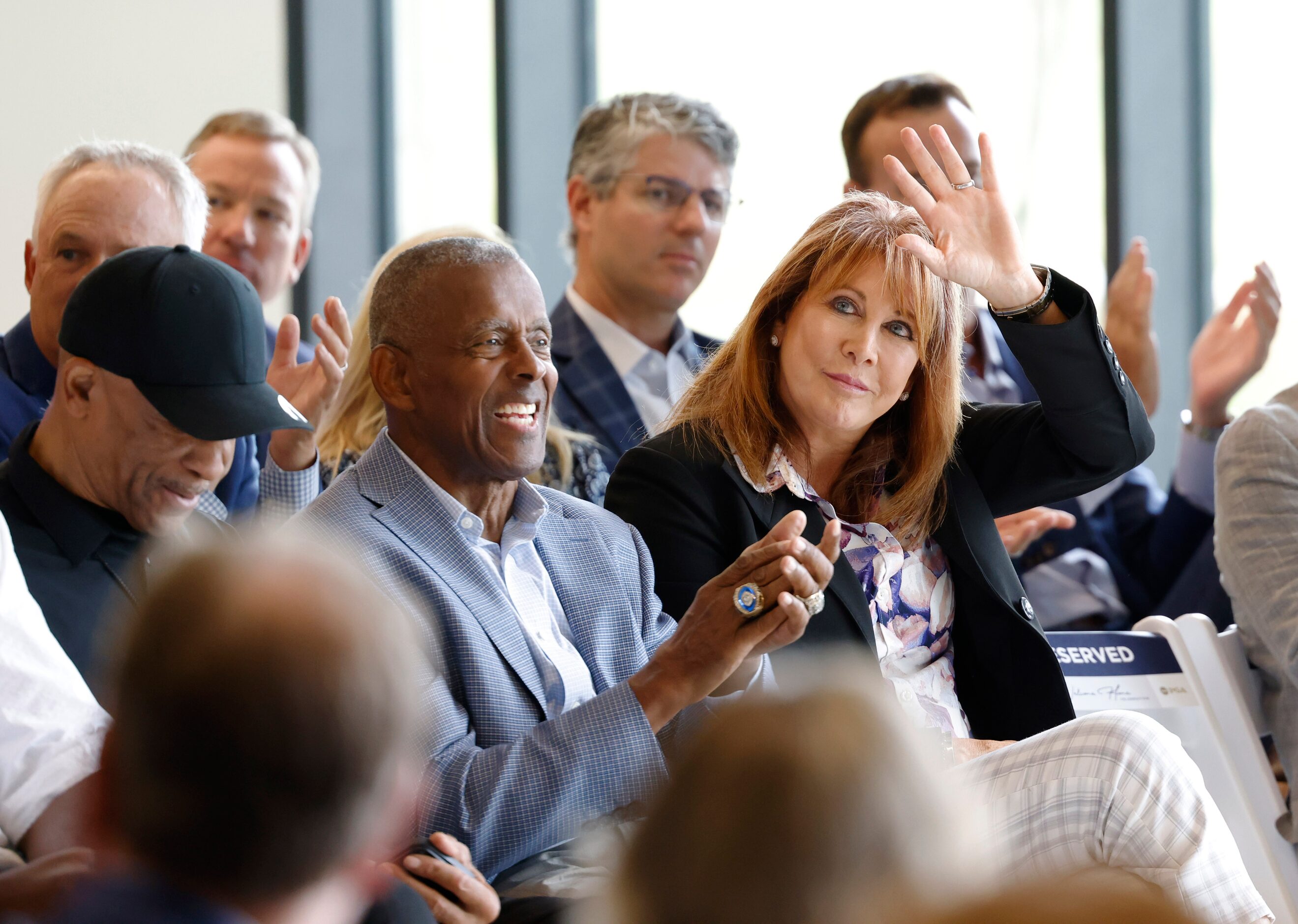 Nancy Lieberman acknowledges the crowd as she sits next to former Dallas Cowboys players...