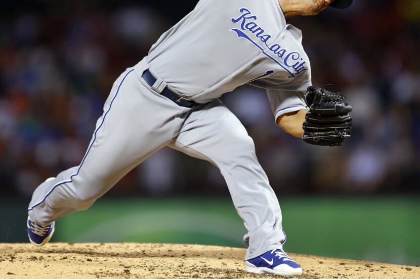 Kansas City Royals starting pitcher Jeremy Guthrie (11) throws against the Texas Rangers at...