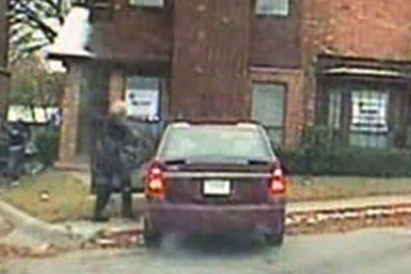 This image from dash camera video shows Dallas police Senior Cpl. Amy Wilburn entering the...