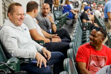 MLB super agent Scott Boras (left) talks with Geron Sands, family friend of Texas Rangers...