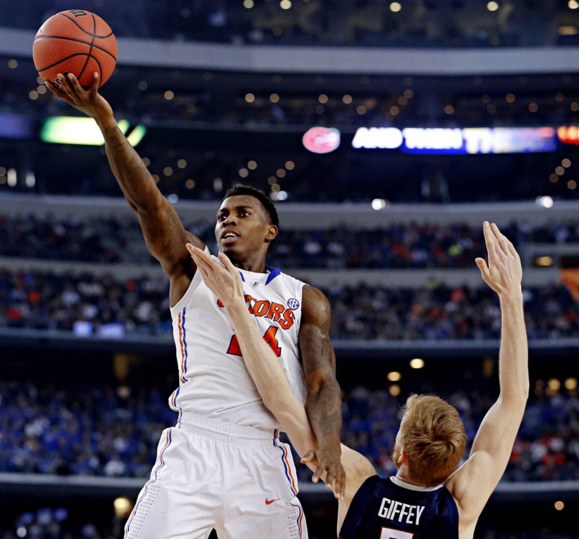 Florida Gators forward Casey Prather (24) gets past Connecticut Huskies guard/forward Niels...